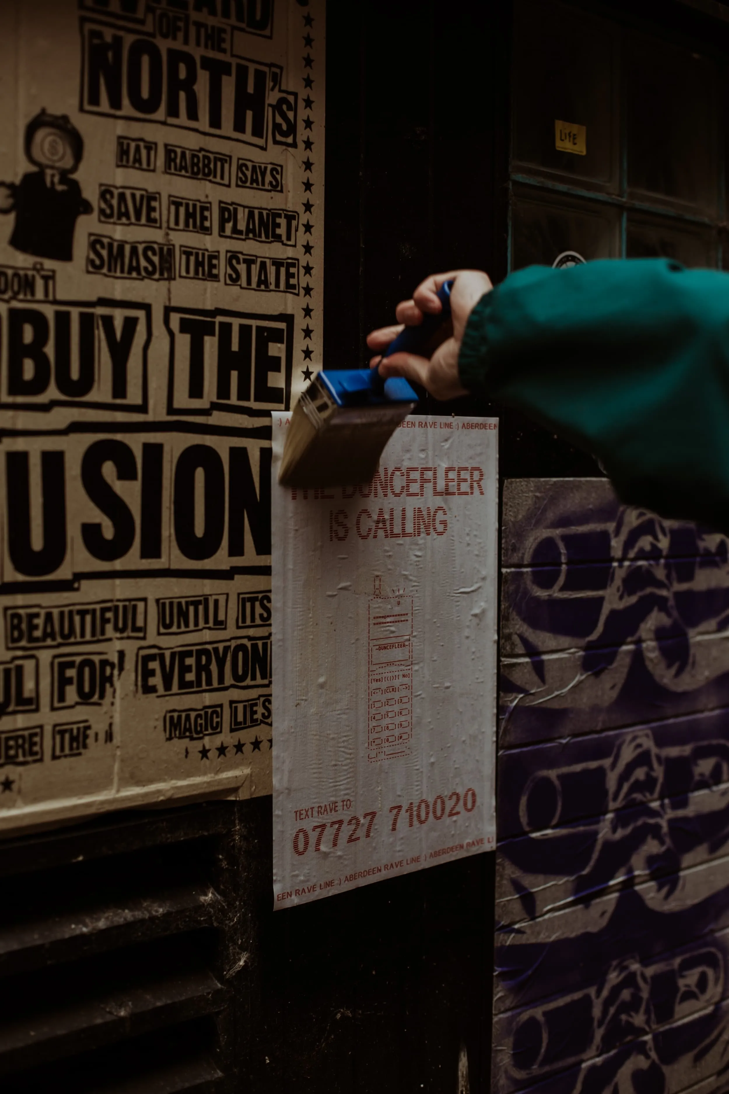 Paint brush pasting up aberdeen rave line riso poster
